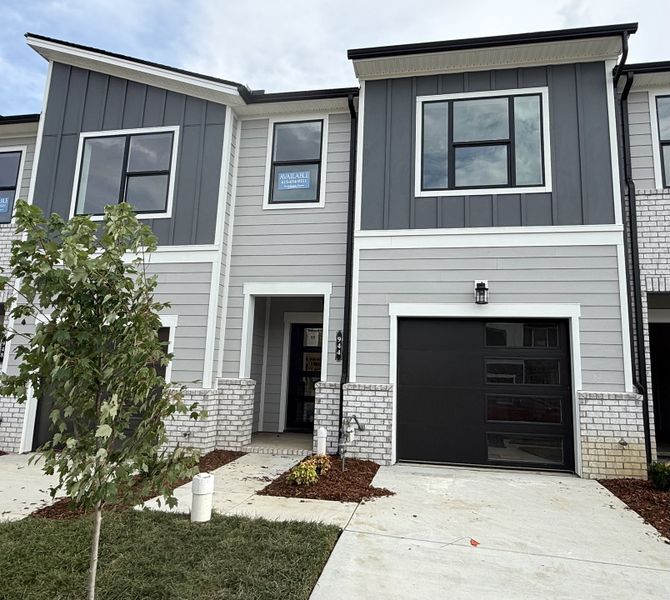 Front exterior of a new home in Nexus Townhomes, Gallatin, TN, highlighting curb appeal (Image 2). Front exterior of a new home in Nexus Townhomes, Gallatin, TN, highlighting curb appeal (Image 2).
