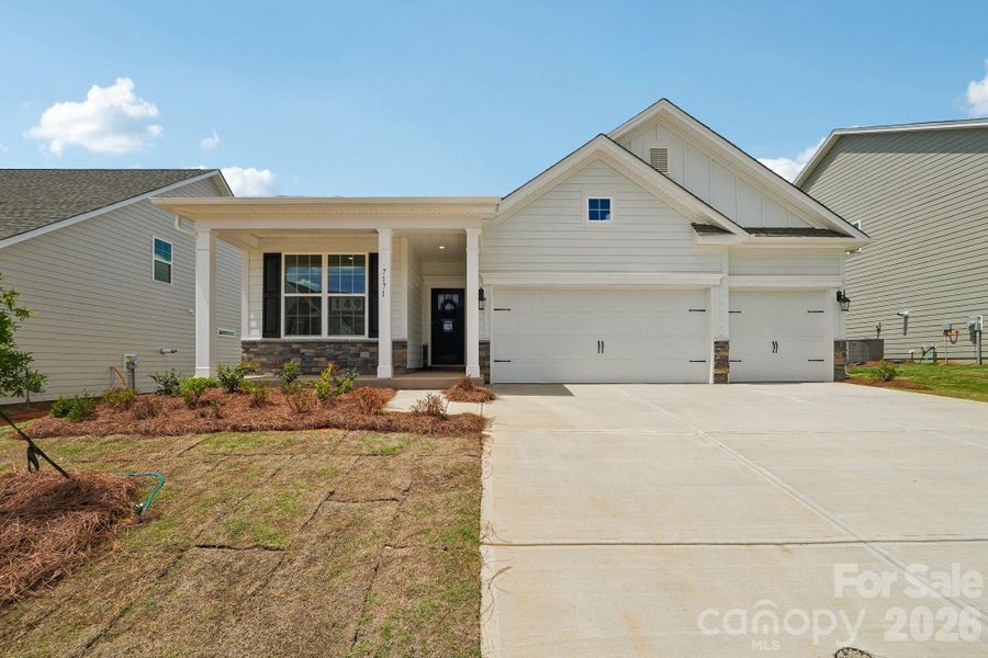Front exterior of a new home in Sylvan Creek, Denver, NC, highlighting curb appeal (Image 1). Front exterior of a new home in Sylvan Creek, Denver, NC, highlighting curb appeal (Image 1).