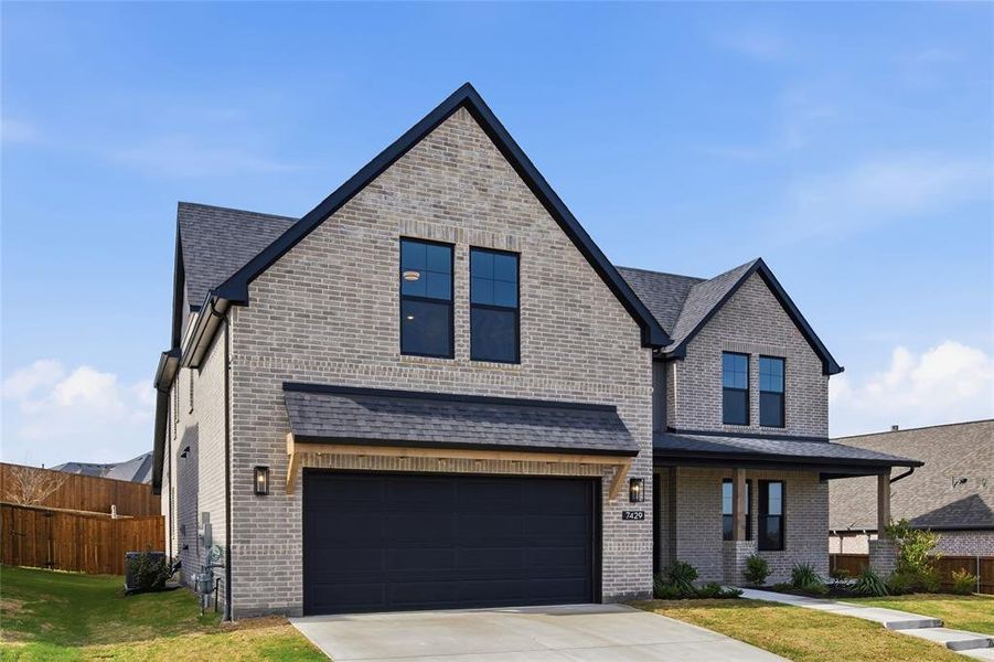 Front exterior of a new home in Talon Hills, Fort Worth, TX, highlighting curb appeal (Image 1). Front exterior of a new home in Talon Hills, Fort Worth, TX, highlighting curb appeal (Image 1).