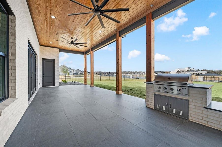 Exterior details and patio area of a home in , Pelican Bay (Image 21).