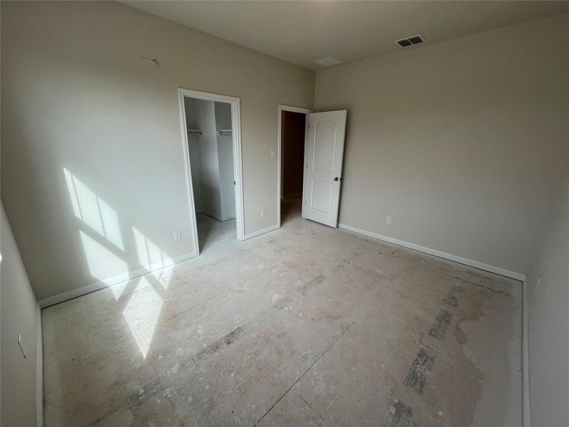 In-progress construction of a new home in The Cottages at Lariat, Liberty Hill, TX (Image 25).