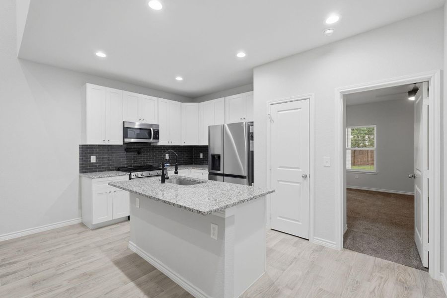 Furnished interior view inside a new home in Arrowhead Lakes, Willis (Image 6).