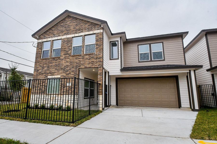 Front exterior of a new home in , Houston, TX, highlighting curb appeal (Image 1).