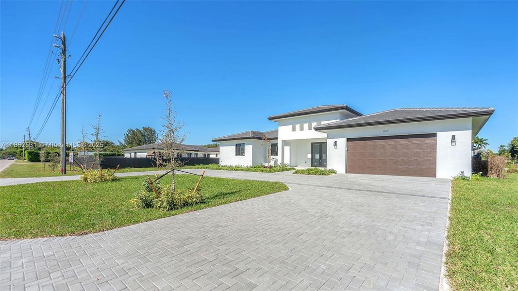 Front exterior of a new home in , Miami, FL, highlighting curb appeal (Image 21).