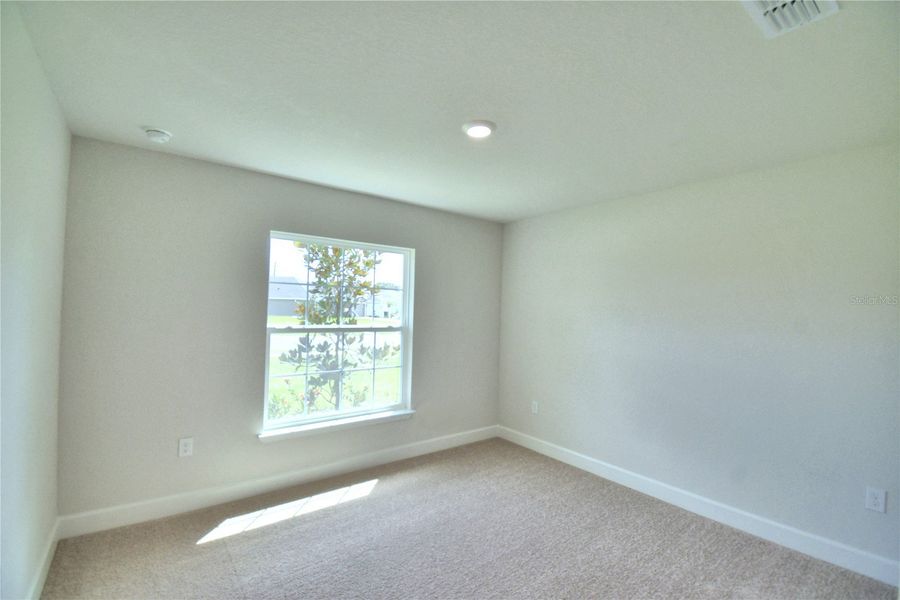 Spacious, unfurnished interior of a new home in Cadence Crossing, Auburndale (Image 29).