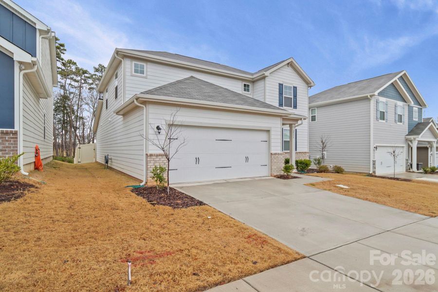 Front exterior of a new home in Blue Sky Meadows, Monroe, NC, highlighting curb appeal (Image 23).