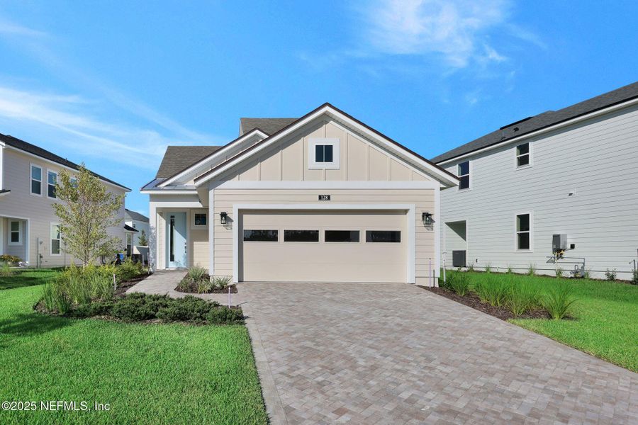 Front exterior of a new home in Crosswinds at Nocatee, Ponte Vedra Beach, FL, highlighting curb appeal (Image 1). Front exterior of a new home in Crosswinds at Nocatee, Ponte Vedra Beach, FL, highlighting curb appeal (Image 1).