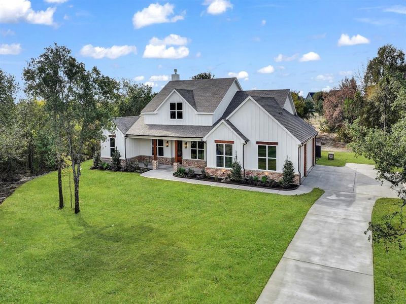 Front exterior of a new home in , Weatherford, TX, highlighting curb appeal (Image 25).