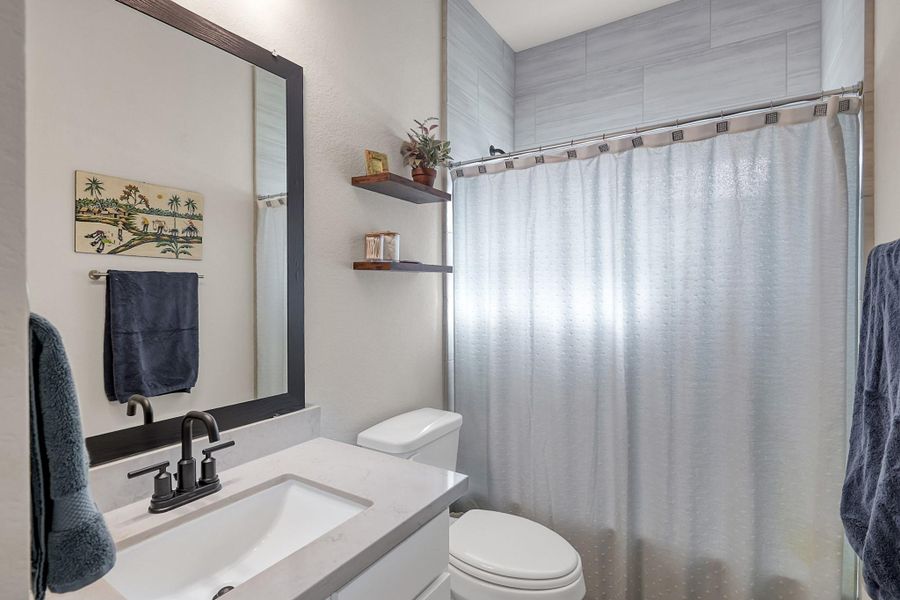 Full bathroom located in between secondary bedroom #1 and secondary bedroom #2