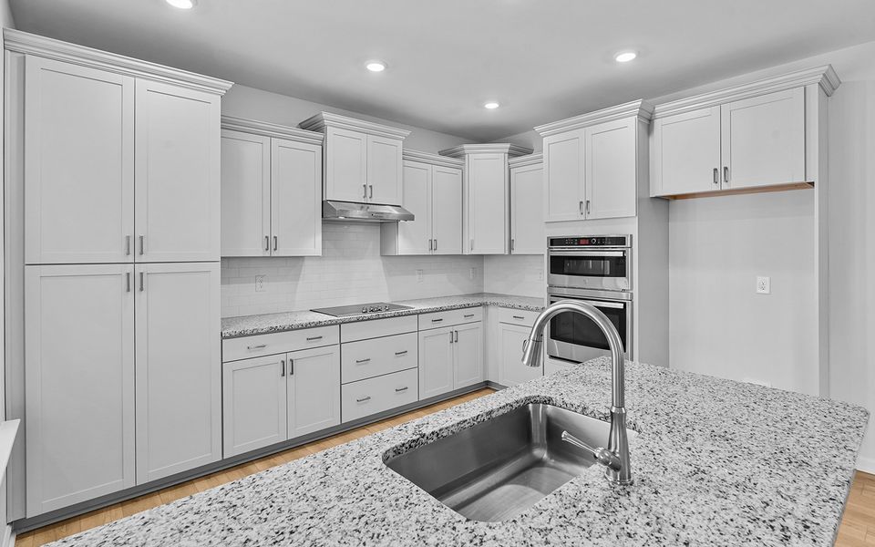 Furnished interior view inside a new home in Brayden, Advance (Image 11).