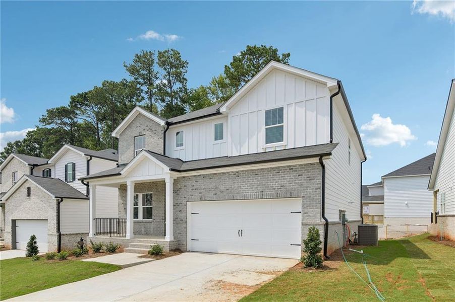 Front exterior of a new home in Martin Springs - Estate Series, Lawrenceville, GA, highlighting curb appeal (Image 24).