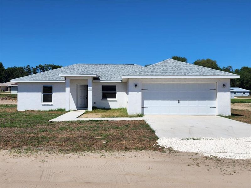 Front exterior of a new home in , Inverness, FL, highlighting curb appeal (Image 19).