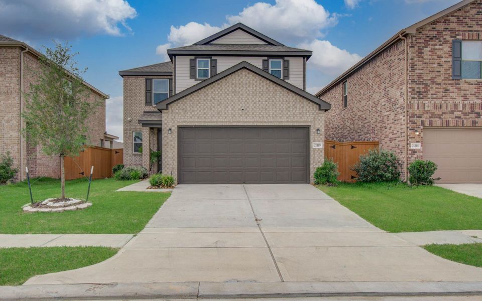 Front exterior of a new home in , Cypress, TX, highlighting curb appeal (Image 2). Front exterior of a new home in , Cypress, TX, highlighting curb appeal (Image 2).