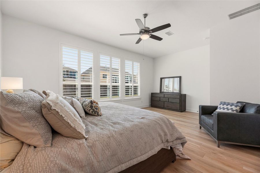 Furnished interior view inside a new home in Bridgeland, Cypress (Image 31).