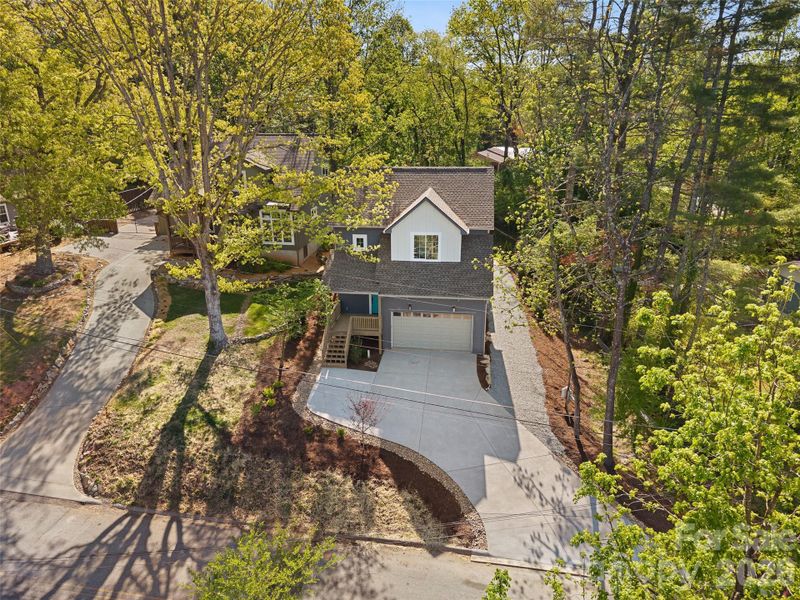 Front exterior of a new home in , Brevard, NC, highlighting curb appeal (Image 24).