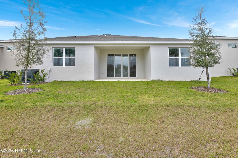 Exterior details and patio area of a home in Seasons at Grandview Gardens, Deland (Image 3).