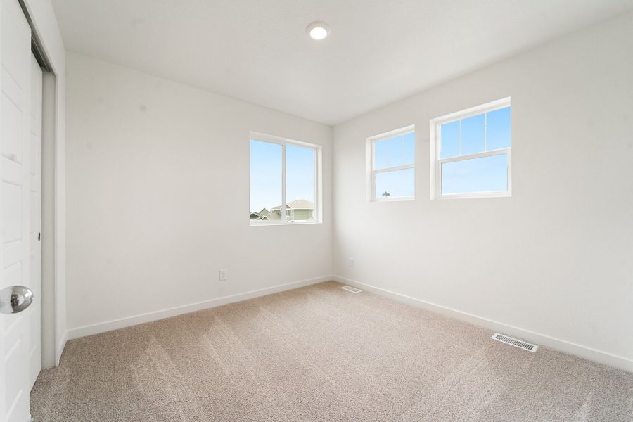 Spacious, unfurnished interior of a new home in Union Colony West, Greeley (Image 14).