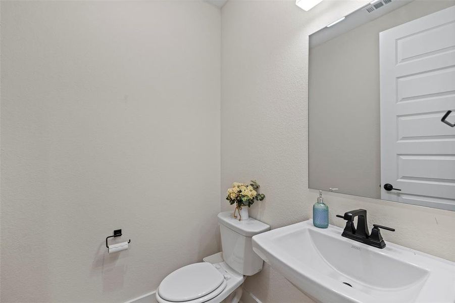 The first floor also has a half bath available for guests.