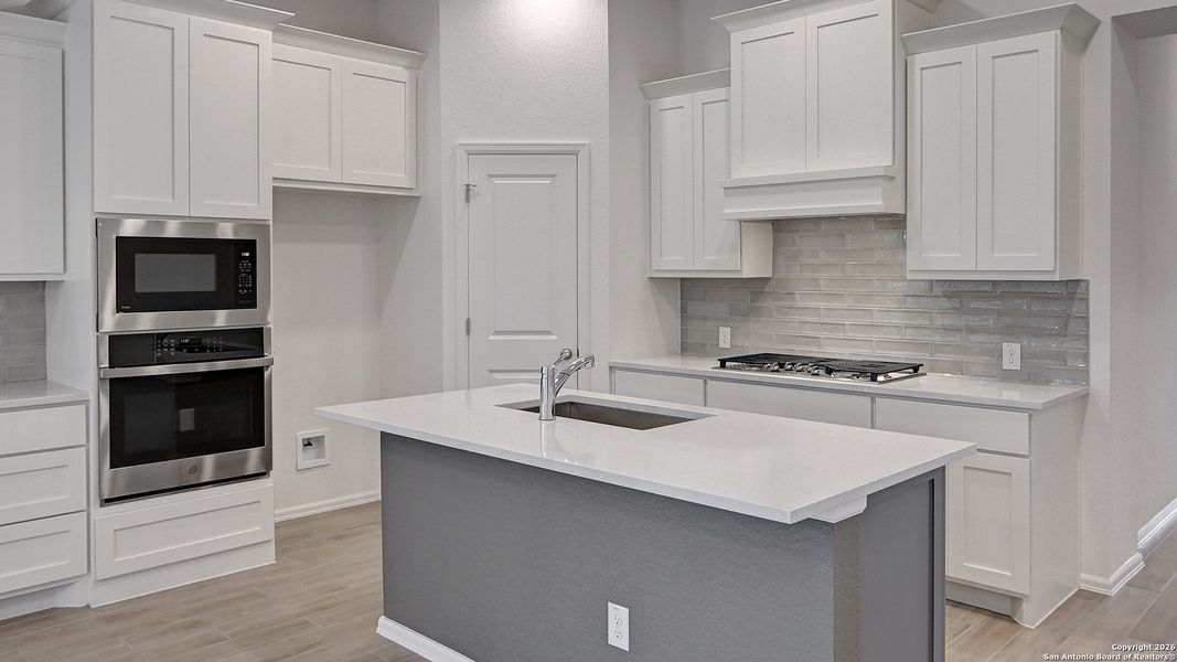 Furnished interior view inside a new home in Ladera 40', San Antonio (Image 13).