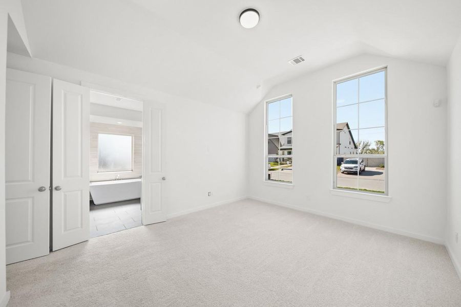 Another view of the primary bedroom.