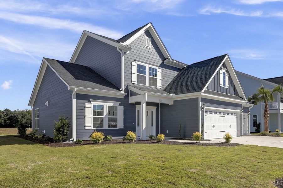 Front exterior of a new home in East Wynd, Hampstead, NC, highlighting curb appeal (Image 2). Front exterior of a new home in East Wynd, Hampstead, NC, highlighting curb appeal (Image 2).