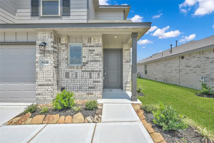 Exterior details and patio area of a home in Lakes at Black Oak, Magnolia (Image 3).