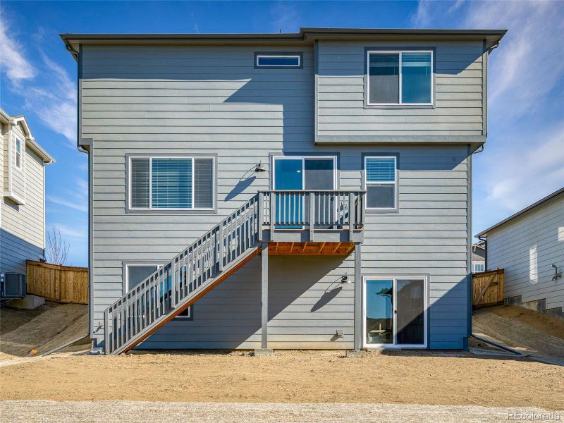 Exterior details and patio area of a home in Buffalo Highlands: The Flora Collection, Commerce City (Image 3).