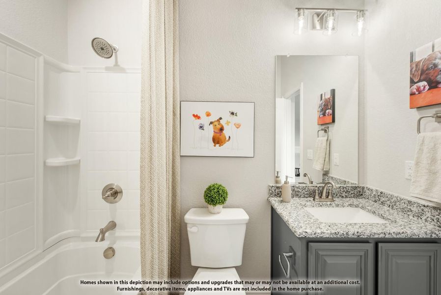 Bathroom with gray vanity, granite countertop, tub-shower combo, and white tile walls