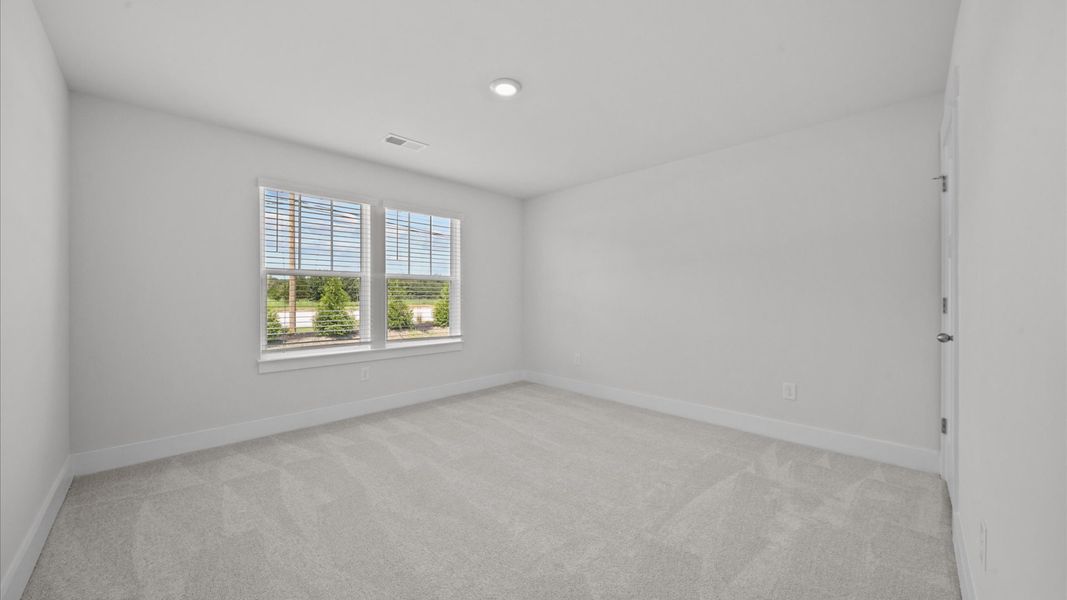 Refined bedroom design with large windows for daylight-filled mornings and peaceful views Refined bedroom design with large windows for daylight-filled mornings and peaceful views