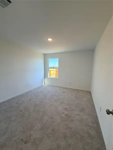 Carpeted empty room featuring baseboards Carpeted empty room featuring baseboards