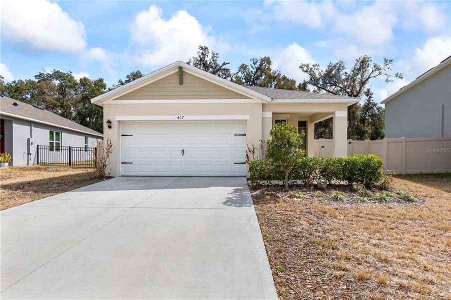 Front exterior of a new home in Pelham Park, Deland, FL, highlighting curb appeal (Image 23).