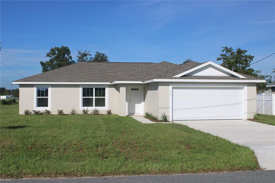 Front exterior of a new home in , Ocala, FL, highlighting curb appeal (Image 14).
