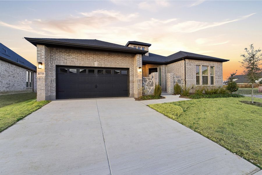 Front exterior of a new home in Green Meadows, Celina, TX, highlighting curb appeal (Image 19). Front exterior of a new home in Green Meadows, Celina, TX, highlighting curb appeal (Image 19).