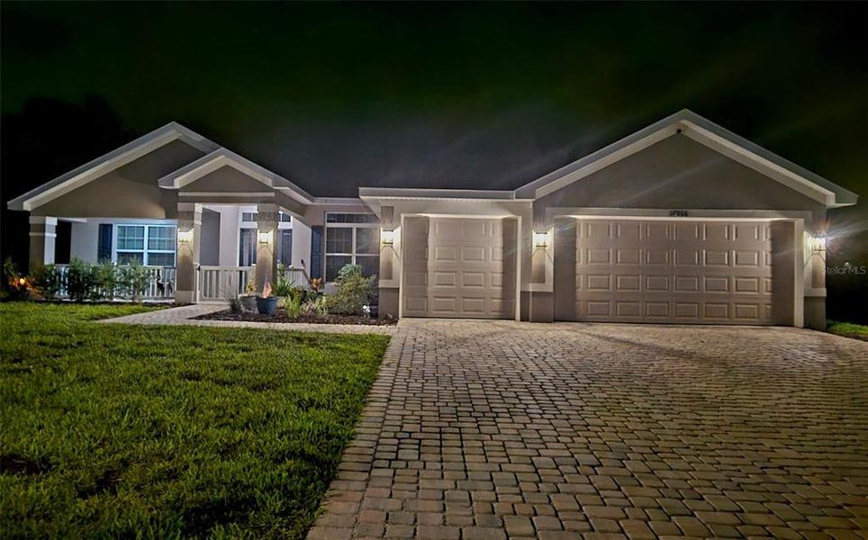 Front exterior of a new home in Juliette Falls, Dunnellon, FL, highlighting curb appeal (Image 26).