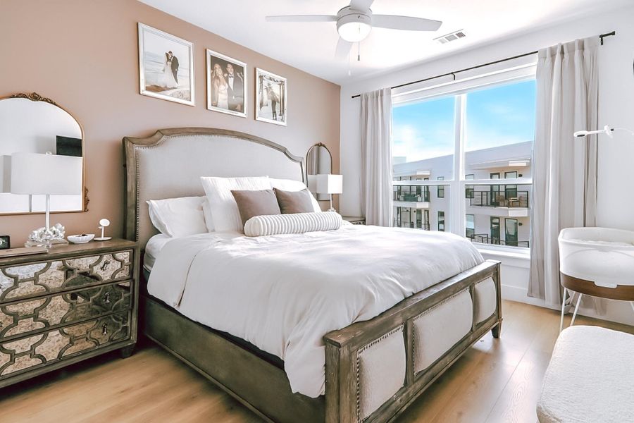 Bedroom featuring light wood-type flooring and a ceiling fan