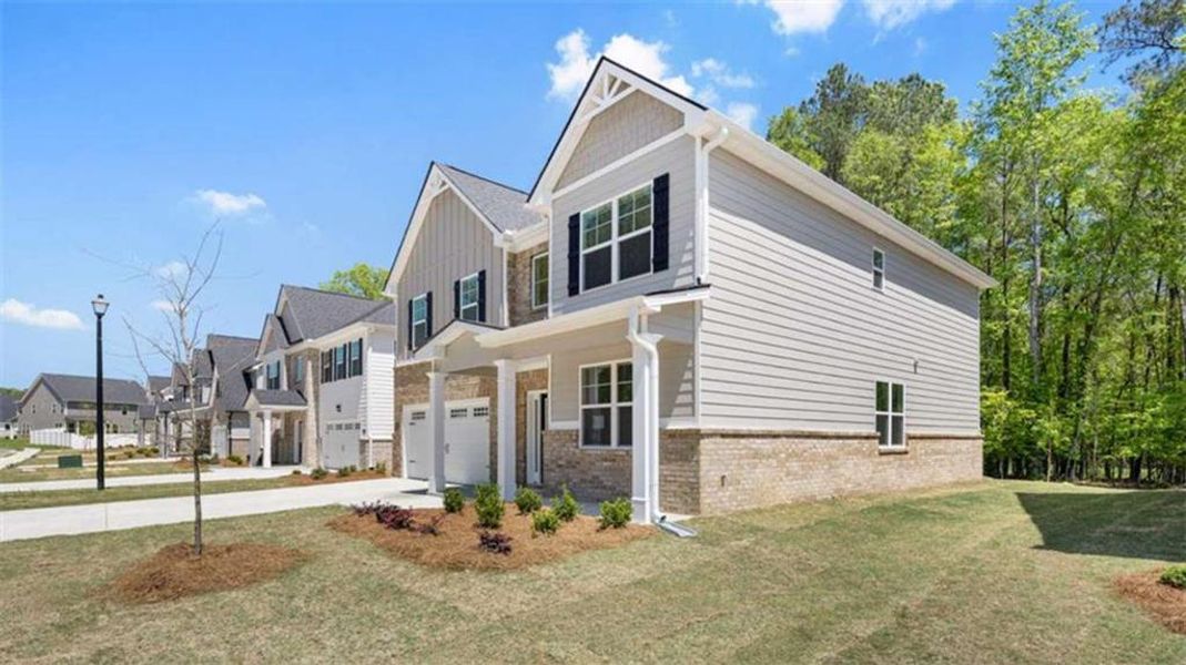 Front exterior of a new home in Wildwood, Covington, GA, highlighting curb appeal (Image 19).