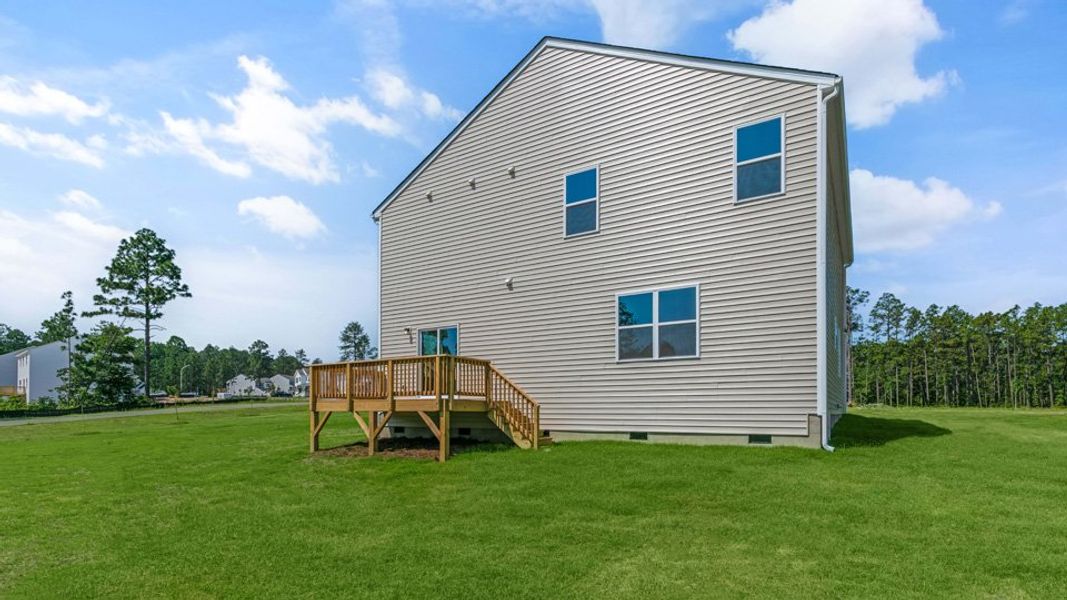 Representative exterior photo of a completed home built from the WILMINGTON by D.R. Horton in Gretchen Pines, West End, NC (Image 22).