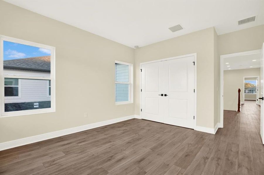 Spacious, unfurnished interior of a new home in The Towns At Long Bayou, Seminole (Image 18).