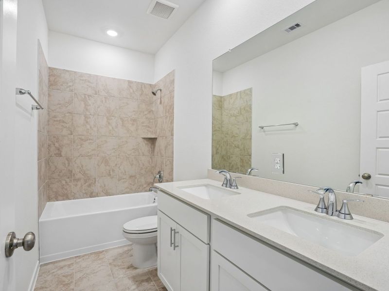 Furnished interior view inside a new home in Granger Pointe - Premier Series, Conroe (Image 8). Furnished interior view inside a new home in Granger Pointe - Premier Series, Conroe (Image 8).