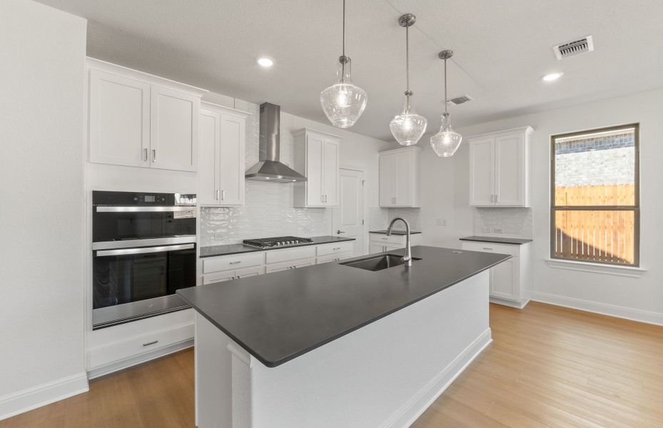 Furnished interior view inside a new home in Saddleback at Santa Rita Ranch, Liberty Hill (Image 7). Furnished interior view inside a new home in Saddleback at Santa Rita Ranch, Liberty Hill (Image 7).