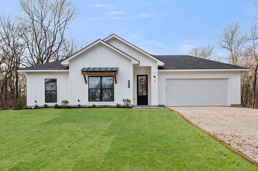 Front exterior of a new home in , Corsicana, TX, highlighting curb appeal (Image 20).