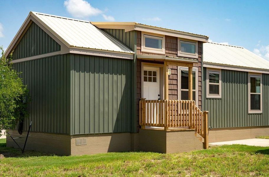 View of front of home with a metal roof and board and batten siding View of front of home with a metal roof and board and batten siding