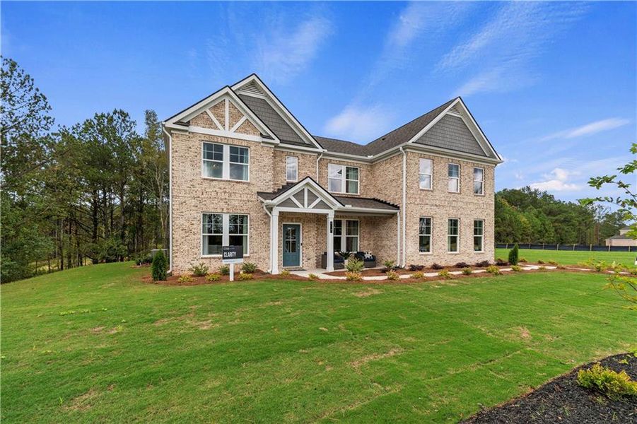 Front exterior of a new home in Trinity Park, McDonough, GA, highlighting curb appeal (Image 22).