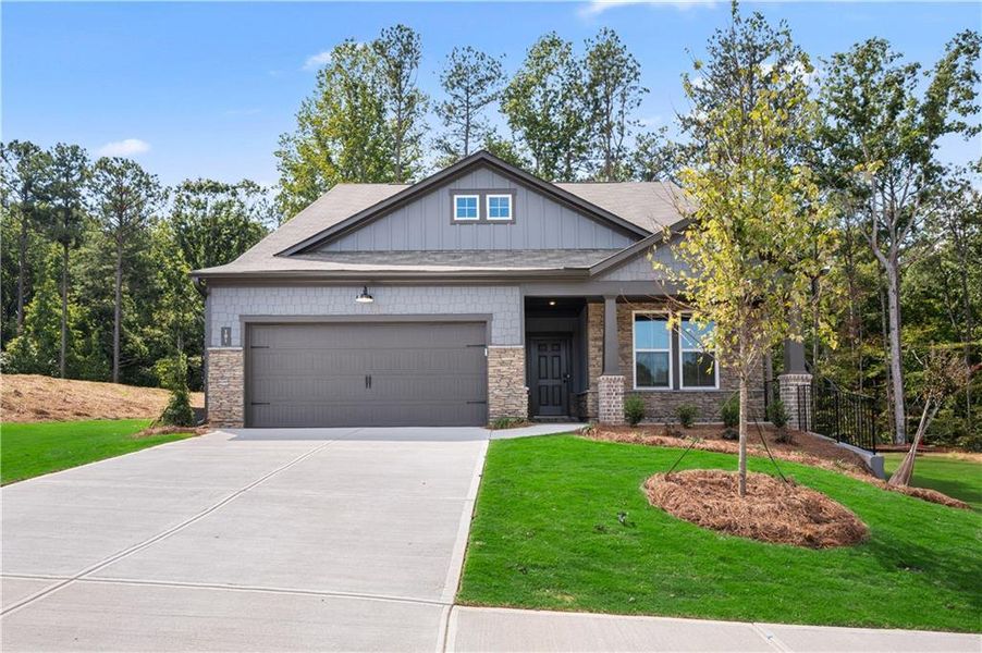 Front exterior of a new home in Cambridge at Steels Bridge: Steels Bridge, Canton, GA, highlighting curb appeal (Image 18). Front exterior of a new home in Cambridge at Steels Bridge: Steels Bridge, Canton, GA, highlighting curb appeal (Image 18).