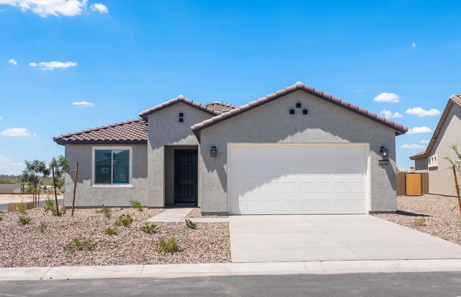 Front exterior of a new home in Sun City Anthem at Merrill Ranch, Florence, AZ, highlighting curb appeal (Image 2). Front exterior of a new home in Sun City Anthem at Merrill Ranch, Florence, AZ, highlighting curb appeal (Image 2).