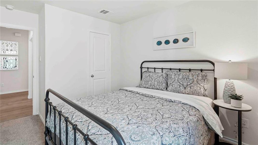 Bedroom featuring baseboards and carpet