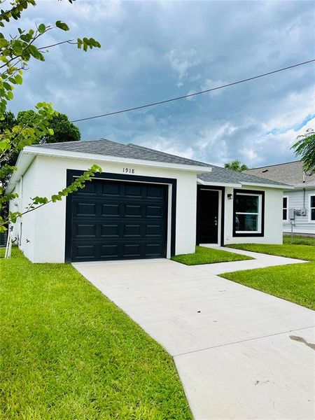 Front exterior of a new home in , Haines City, FL, highlighting curb appeal (Image 4). Front exterior of a new home in , Haines City, FL, highlighting curb appeal (Image 4).