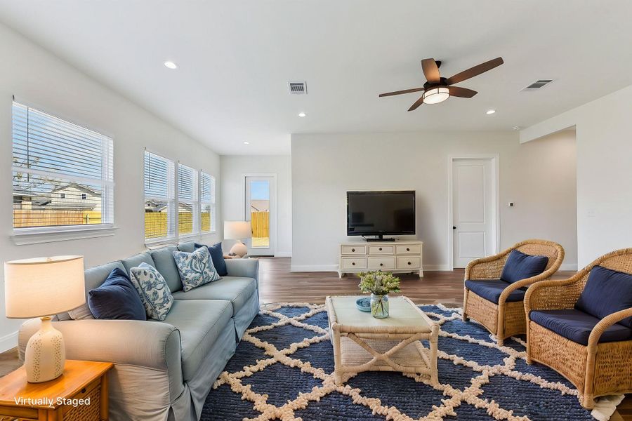 Virtually Staged Living room with recessed lighting, visible vents, and wood finished floors Virtually Staged Living room with recessed lighting, visible vents, and wood finished floors