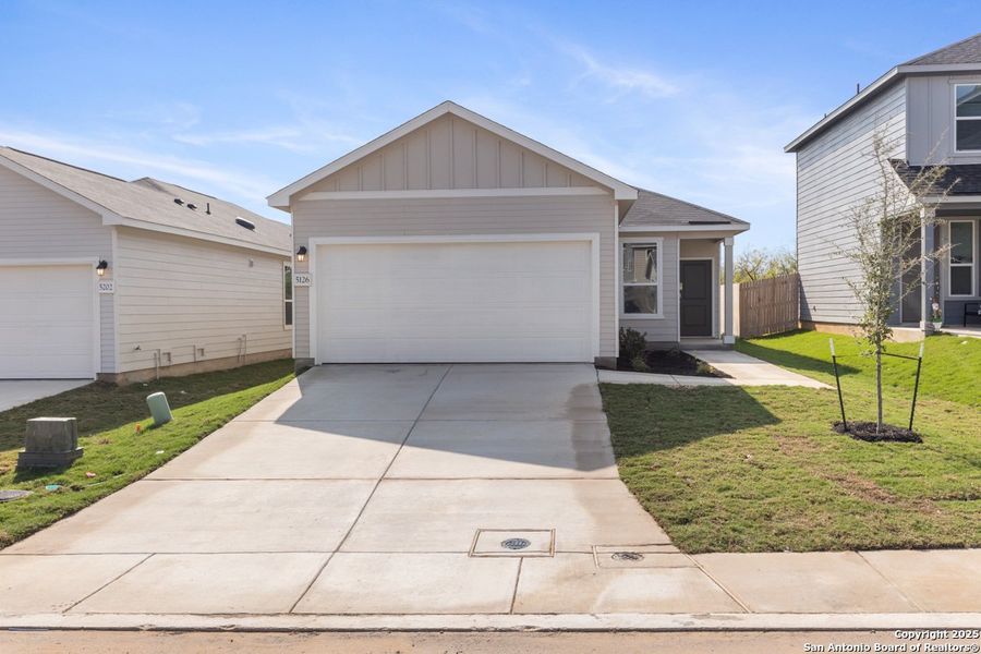 Front exterior of a new home in Southton Cove, Elmendorf, TX, highlighting curb appeal (Image 1). Front exterior of a new home in Southton Cove, Elmendorf, TX, highlighting curb appeal (Image 1).