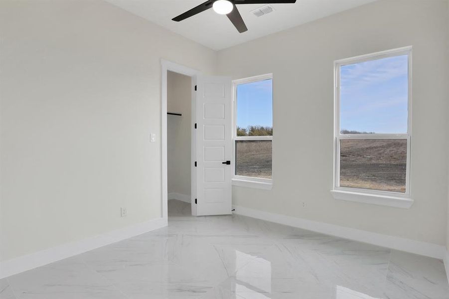 Spare room featuring ceiling fan